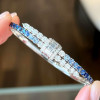 8ctw Gradient Blue and White Sapphire Bypass Bangle