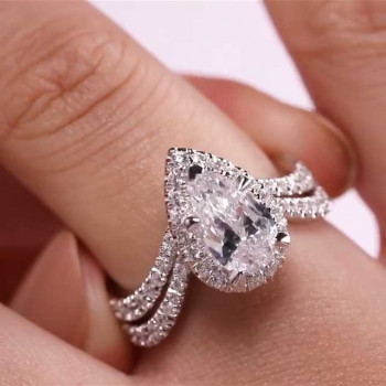 Halo Pear Cut White Sapphire Twist Engagement Ring