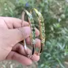 Simple Round Cut Emerald Bangle in Gold