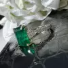 8ct Emerald Cut Emerald Three Stone Engagement Ring