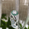 2ct Round Cut White Sapphire Ring with a Emerald Calibre Halo