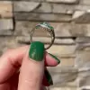 2ct Round Cut White Sapphire Ring with a Emerald Calibre Halo
