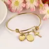 Gold Tone Charm Bracelet in Stainless Steel