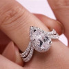 Halo Pear Cut White Sapphire Twist Engagement Ring