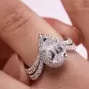 Halo Pear Cut White Sapphire Twist Engagement Ring