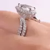 Halo Pear Cut White Sapphire Twist Engagement Ring
