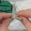 Unique Rose Gold Tone Oval Cut White Sapphire Ring with Curved Eternity Band