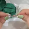 Unique Rose Gold Tone Oval Cut White Sapphire Ring with Curved Eternity Band