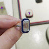 Sapphire Calibre Halo Emerald Cut Engagement Ring