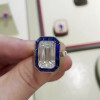 Sapphire Calibre Halo Emerald Cut Engagement Ring