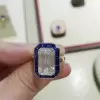 Sapphire Calibre Halo Emerald Cut Engagement Ring