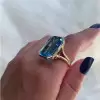8.5ct Emerald Cut Blue Topaz Split Shank Engagement Ring
