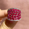 25.5ctw Oval Shaped Ruby Saddle Ring with Diamond Prongs