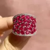 25.5ctw Oval Shaped Ruby Saddle Ring with Diamond Prongs