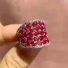 25.5ctw Oval Shaped Ruby Saddle Ring with Diamond Prongs