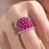 25.5ctw Oval Shaped Ruby Saddle Ring with Diamond Prongs