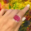 25.5ctw Oval Shaped Ruby Saddle Ring with Diamond Prongs