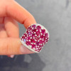 25.5ctw Oval Shaped Ruby Saddle Ring with Diamond Prongs
