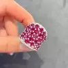 25.5ctw Oval Shaped Ruby Saddle Ring with Diamond Prongs