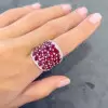 25.5ctw Oval Shaped Ruby Saddle Ring with Diamond Prongs