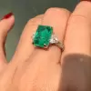 8ct Emerald Cut Emerald Three Stone Engagement Ring