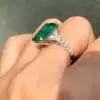 8ct Emerald Cut Emerald Three Stone Engagement Ring