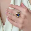 Oval Cut Tanzanite Blue Sapphire Fluid Edge Cocktail Ring