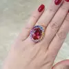 13ct Oval Cut Ruby Rainbow Halo Cocktail Ring