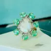 5ct Pear-shaped Opal Emerald Halo Cocktail Ring