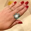5ct Pear-shaped Opal Emerald Halo Cocktail Ring