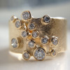 Round Cut White Sapphire Scattered Asymmetric Cigar Band