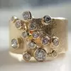 Round Cut White Sapphire Scattered Asymmetric Cigar Band