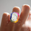 8.4ct Emerald Cut White Sapphire Rainbow Halo Cocktail Ring