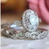 Vintage Leaf & Vine Art Deco Halo Oval Cut Bridal Set