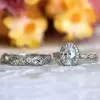 Vintage Leaf & Vine Art Deco Halo Oval Cut Bridal Set