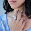 Round Cut Twilight Oval-shaped Paved Cocktail Ring