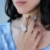 Round Cut Twilight Oval-shaped Paved Cocktail Ring