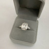 2.5ct Emerald Cut White Sapphire Three-Stone Engagement Ring