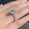 Pear Cut 3 Carat Encrusted Engagement Ring Following By Emerald Cut Eternity Band