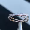 Fashion Criss Cross Baguette & Round Diamond Anniversary Band in Rose Gold Tone