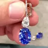 Oval Cut Blue Sapphire Dangle Earrings