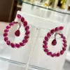Nature-inspired Pear and Oval Cut Ruby Statement Earrings