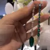 3.95ct Mismatch Shield Cut Emeralds White Sapphire Drop Earrings