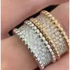 Round Cut White Sapphire Eternity Band in Gold