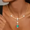 4ct Emerald Cut Emerald With Ruby Halo Pendant Necklace