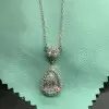 3ct Pear Cut White Sapphire Halo Pendant Necklace