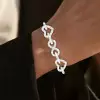 28ctw White Sapphire Paved Infinity Heart Statement Bracelet