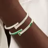 5.5ctw Multi-cut Emerald and White Sapphire Bypass Bangle