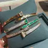 5.5ctw Multi-cut Emerald and White Sapphire Bypass Bangle