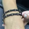 4.5ctw White and Black Sapphire Paved Bamboo Bangle